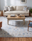Captivating Timeless Light Blue Hand Knotted Wool Rug in a living room