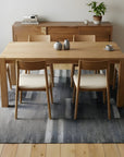 Cassandra Clara Gray and Ivory Flatweave Wool Rug in a dining room