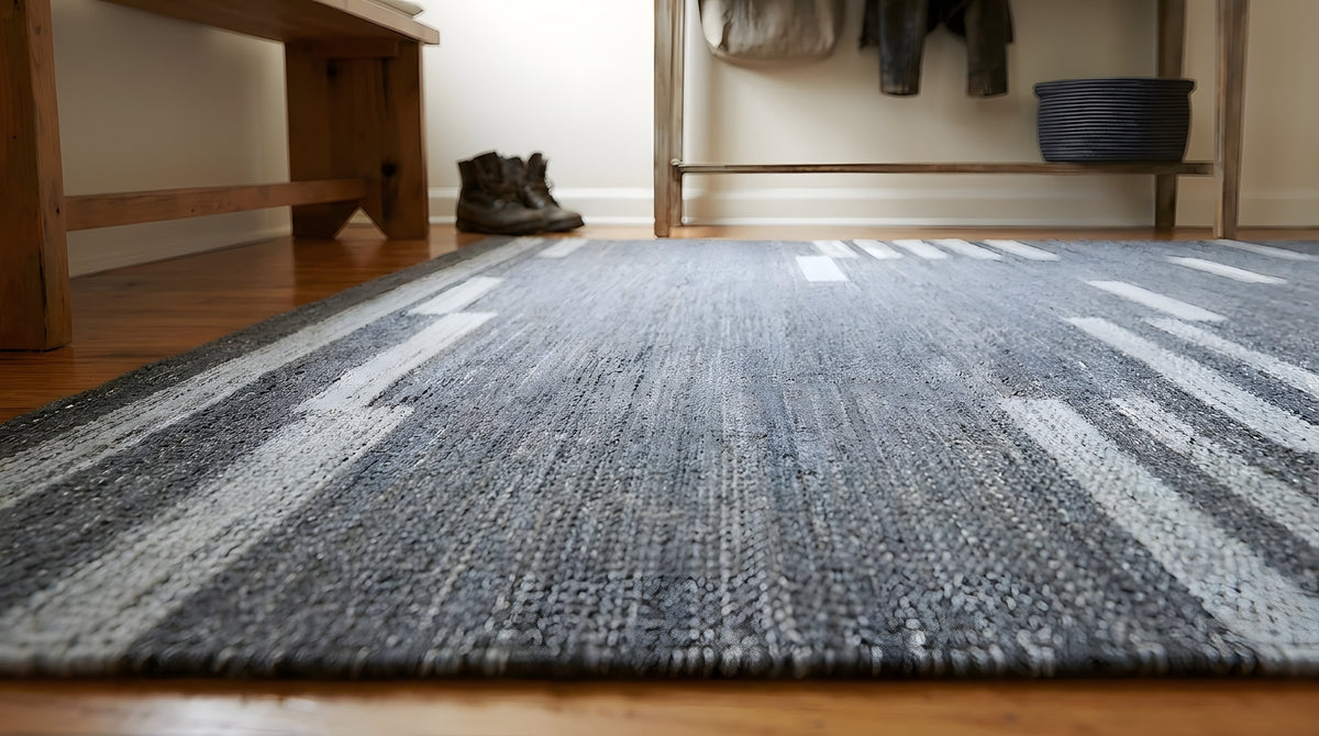 Cassandra Clara Gray and Ivory Flatweave Wool Rug in a entryway