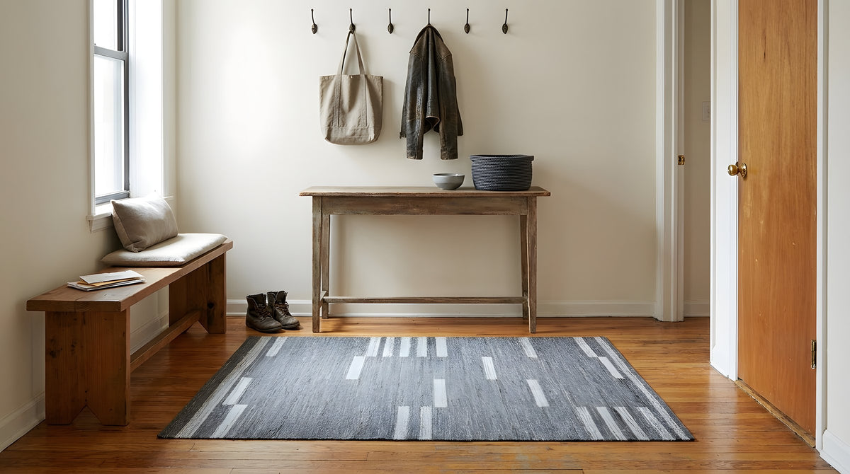 Cassandra Clara Gray and Ivory Flatweave Wool Rug in a entryway