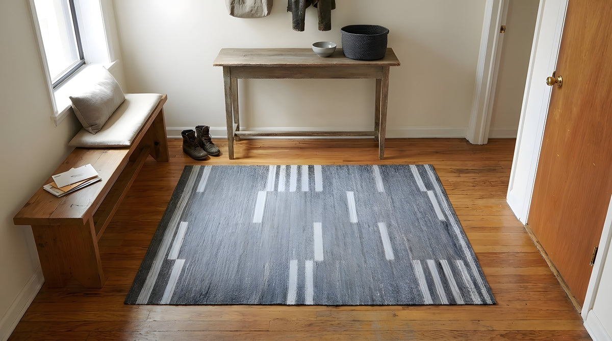 Cassandra Clara Gray and Ivory Flatweave Wool Rug in a entryway