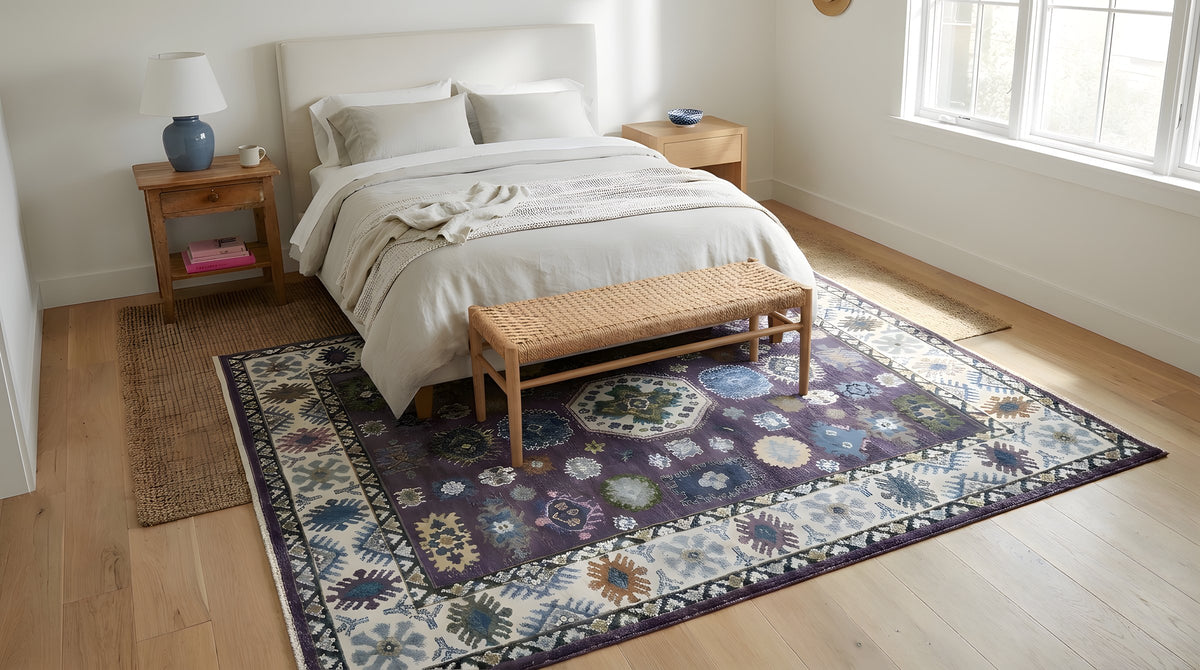 Cassandra Kazak Purple Hand Knotted Wool Rug in a bedroom