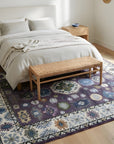 Cassandra Kazak Purple Hand Knotted Wool Rug in a bedroom