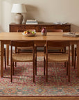 Celia Oushak Rust Hand Knotted Wool Rug in a dining room
