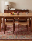Celia Oushak Rust Hand Knotted Wool Rug in a dining room