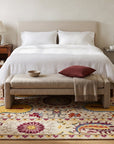 Chic Delicate Ivory Hand Tufted Wool Rug in a bedroom