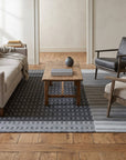 Clara Xena Charcoal Flatweave Wool & Cotton Rug in a living room
