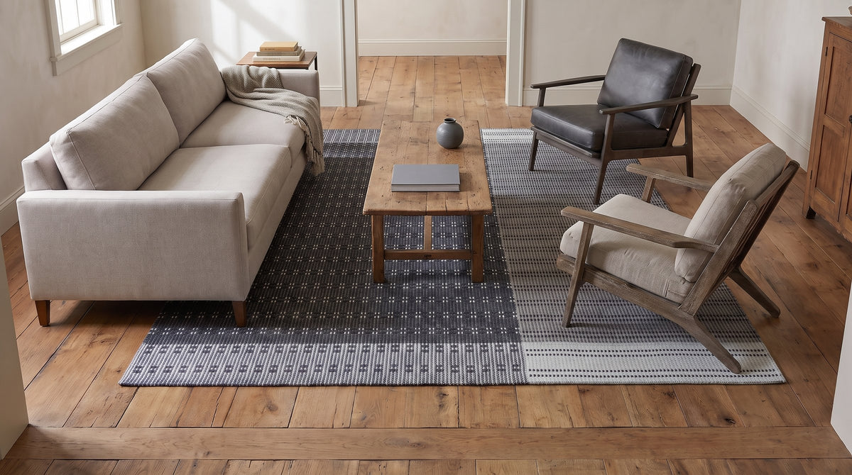 Clara Xena Charcoal Flatweave Wool & Cotton Rug in a living room
