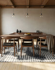 Classic Mira Gray Hand Knotted Wool Rug in a dining room