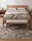 Cozy Quinn Gray Hand Tufted Wool Rug in a bedroom