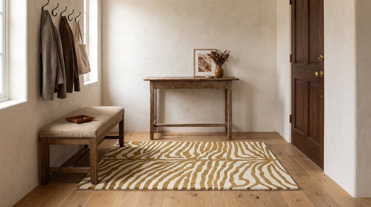 Dahlia Sleek Gold Hand Tufted Wool Rug in a entryway