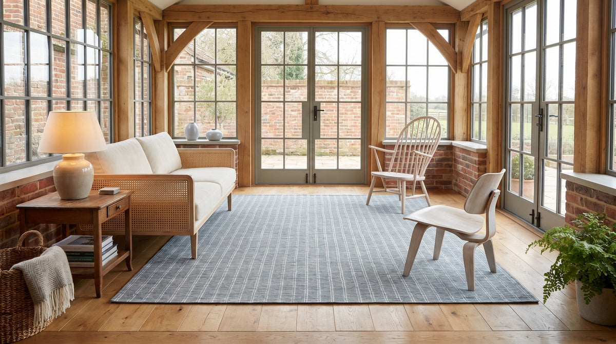 Delicate Giselle Gray Handmade Wool Rug in a sunroom
