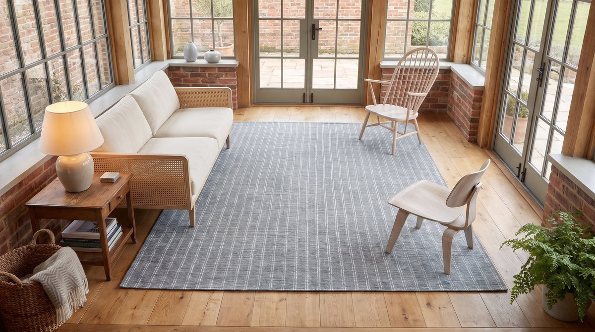 Delicate Giselle Gray Handmade Wool Rug in a sunroom