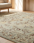 Elena Rustic Green Hand Knotted Wool Rug in a sunroom