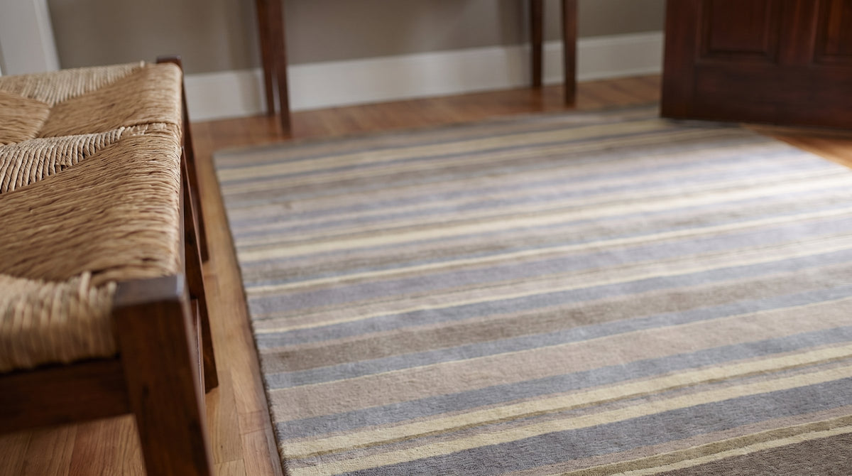 Ella Rustic Brown and Blue Handmade Wool Rug in a entryway