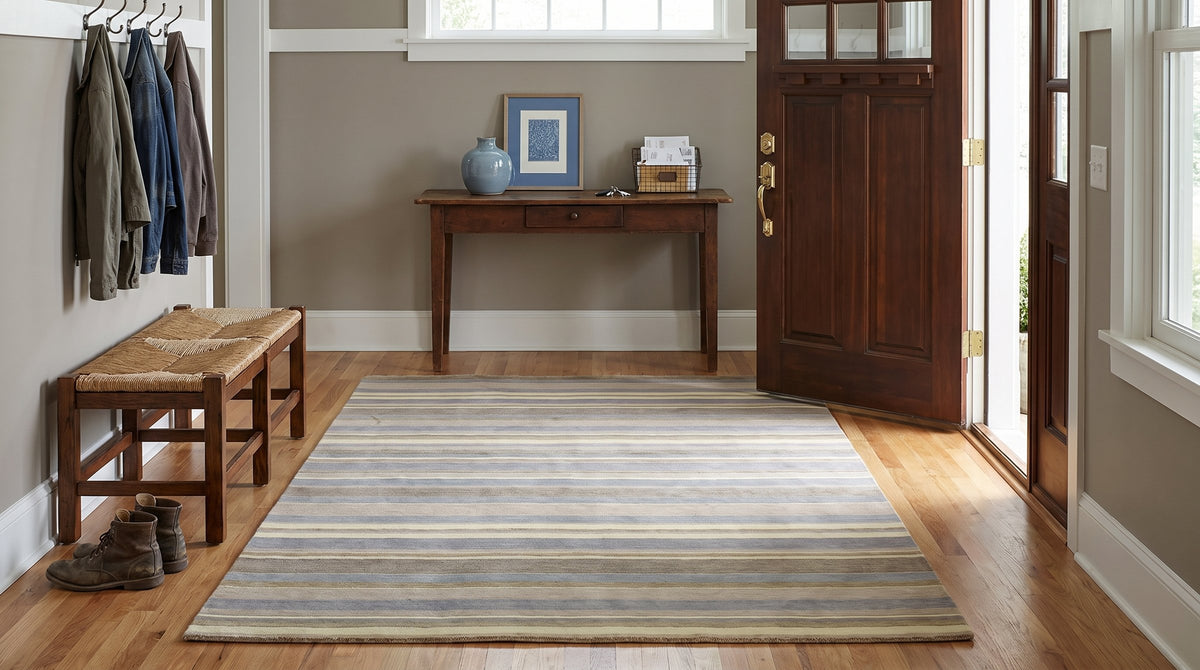 Ella Rustic Brown and Blue Handmade Wool Rug in a entryway
