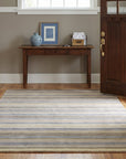 Ella Rustic Brown and Blue Handmade Wool Rug in a entryway
