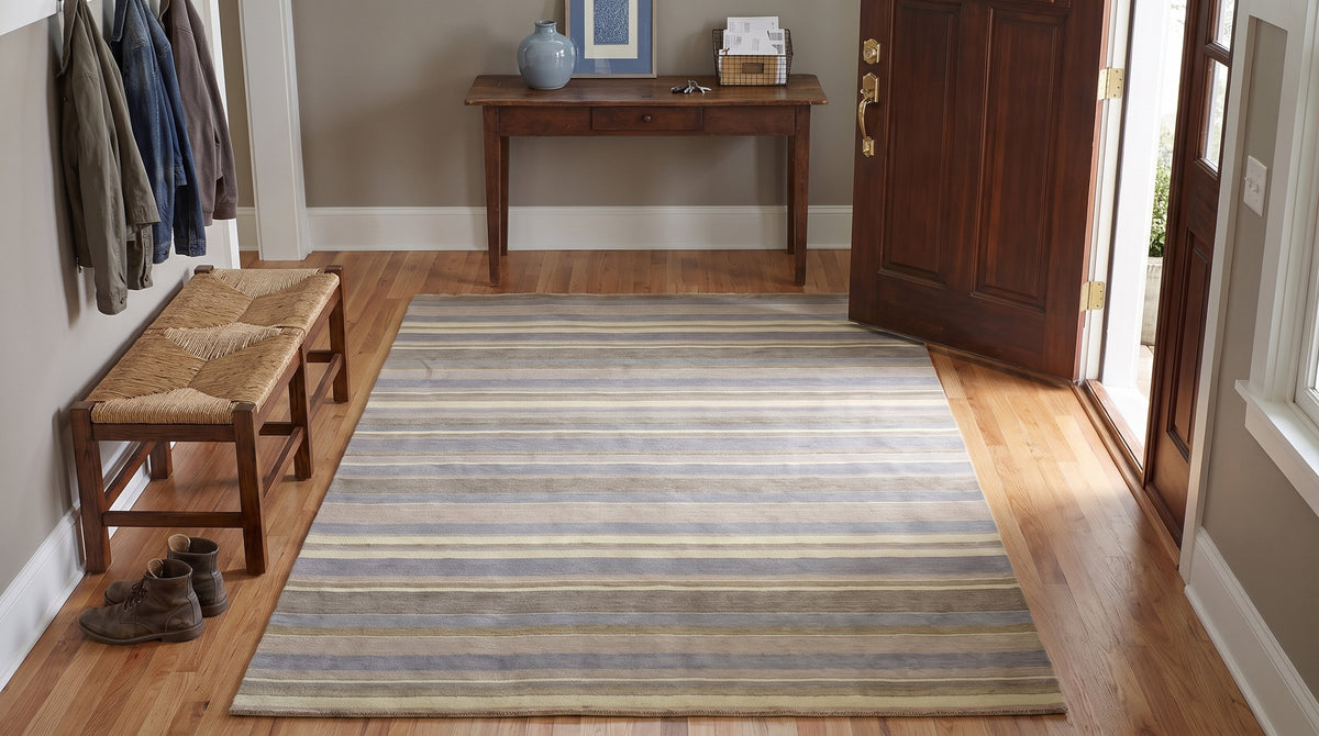 Ella Rustic Brown and Blue Handmade Wool Rug in a entryway