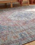 Ember Heritage Blue Handmade Wool Rug in a sunroom