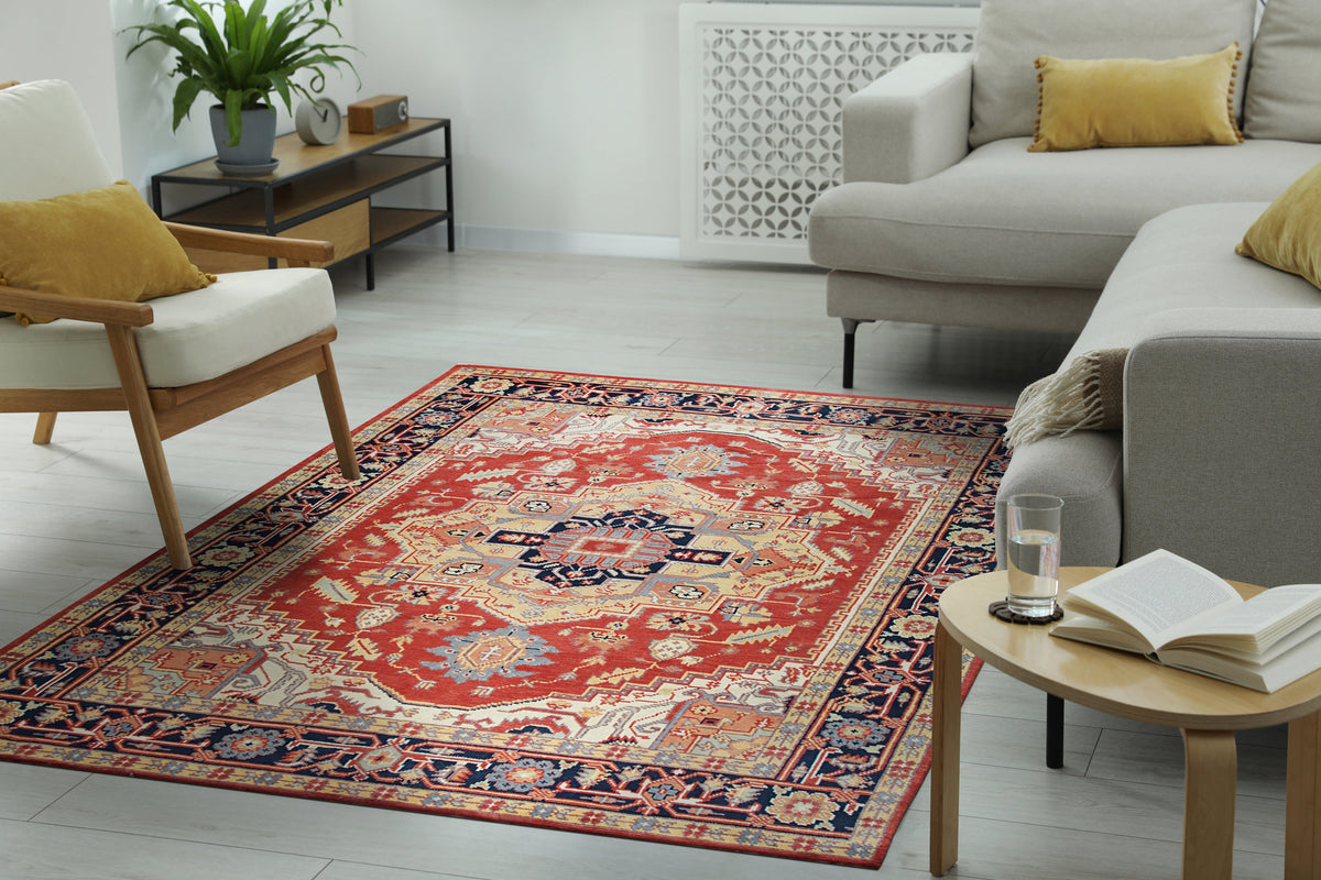 Red hand-knotted wool rug in a bright living room