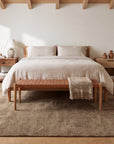Exquisite Yara Brown Hand Knotted Wool Rug in a bedroom