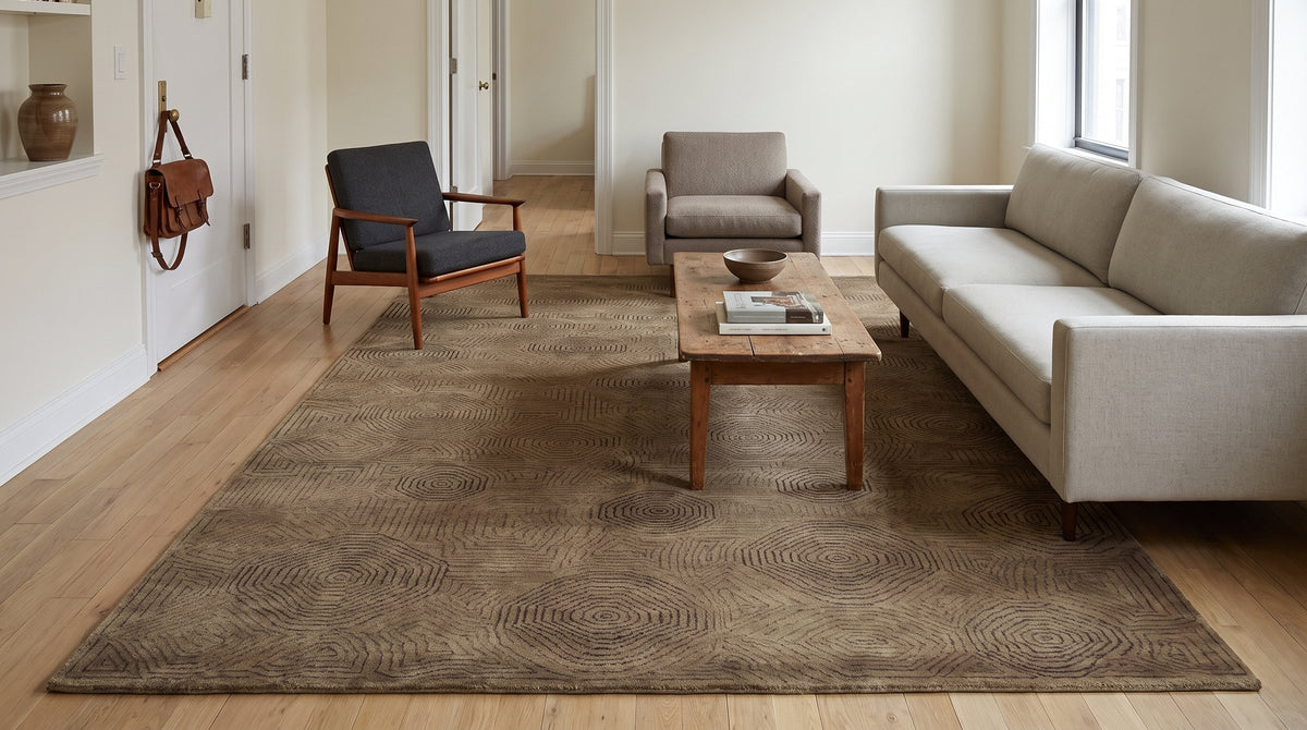 Exquisite Yara Brown Hand Knotted Wool Rug in a living room