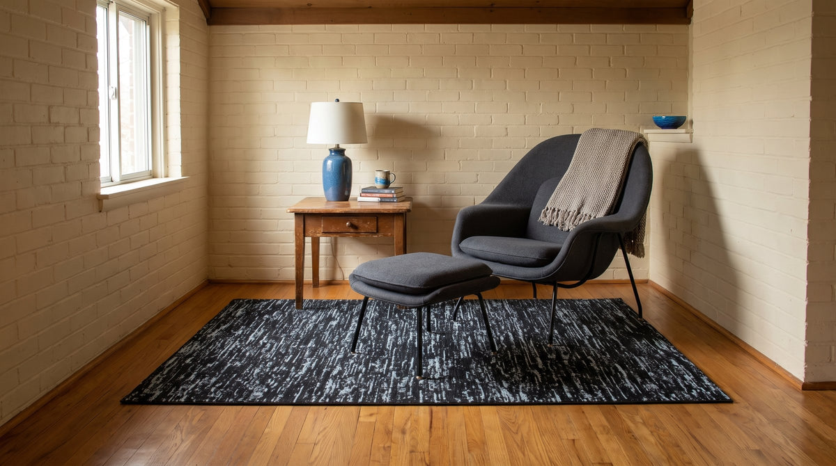 Fiona Rustic Black Flatweave Wool Rug in a reading nook
