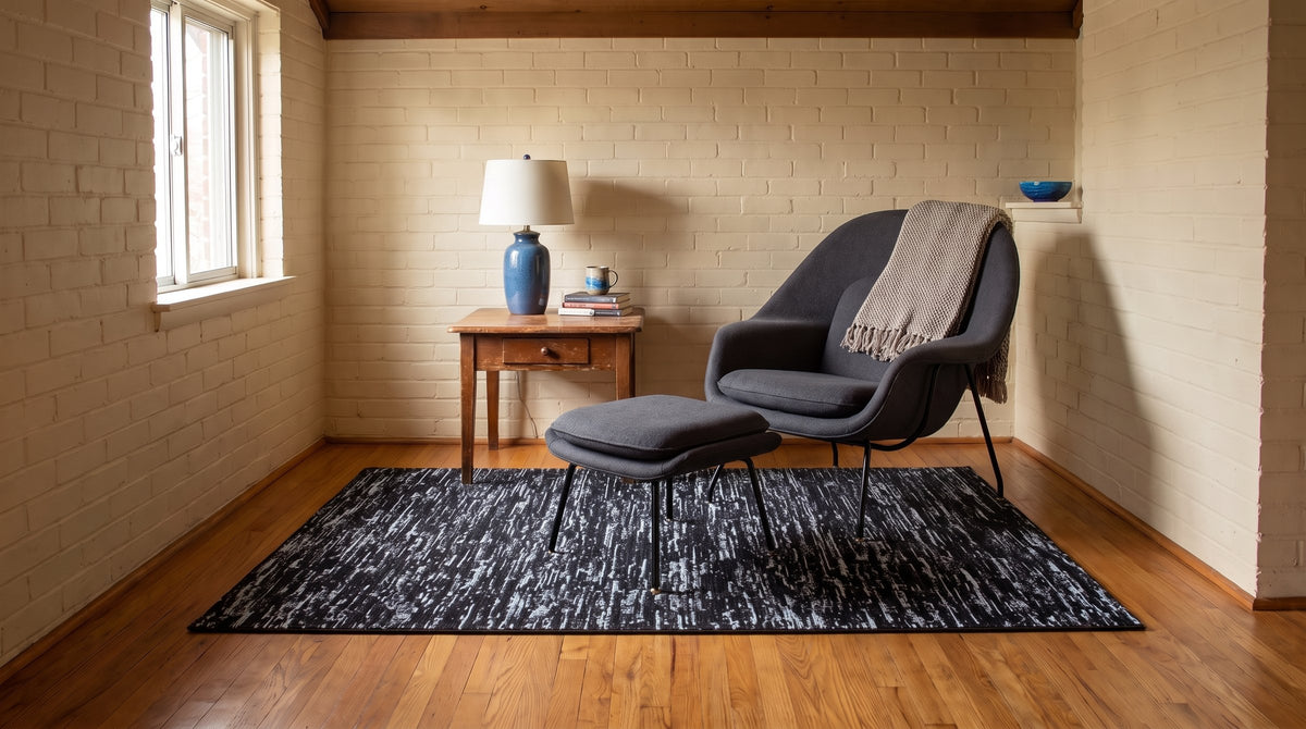 Fiona Rustic Black Flatweave Wool Rug in a reading nook