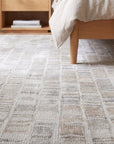 Freya Timeless Ivory Hand Knotted Wool Rug in a bedroom