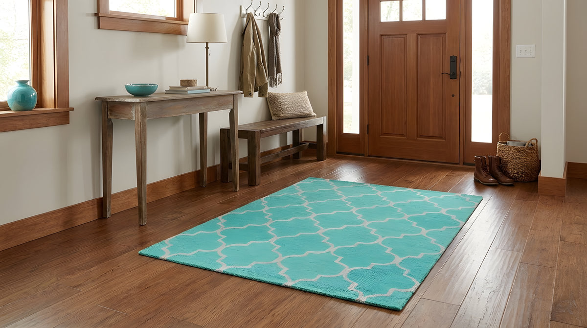 Giselle Moroccan Teal Green Hand Tufted Wool Rug in a entryway