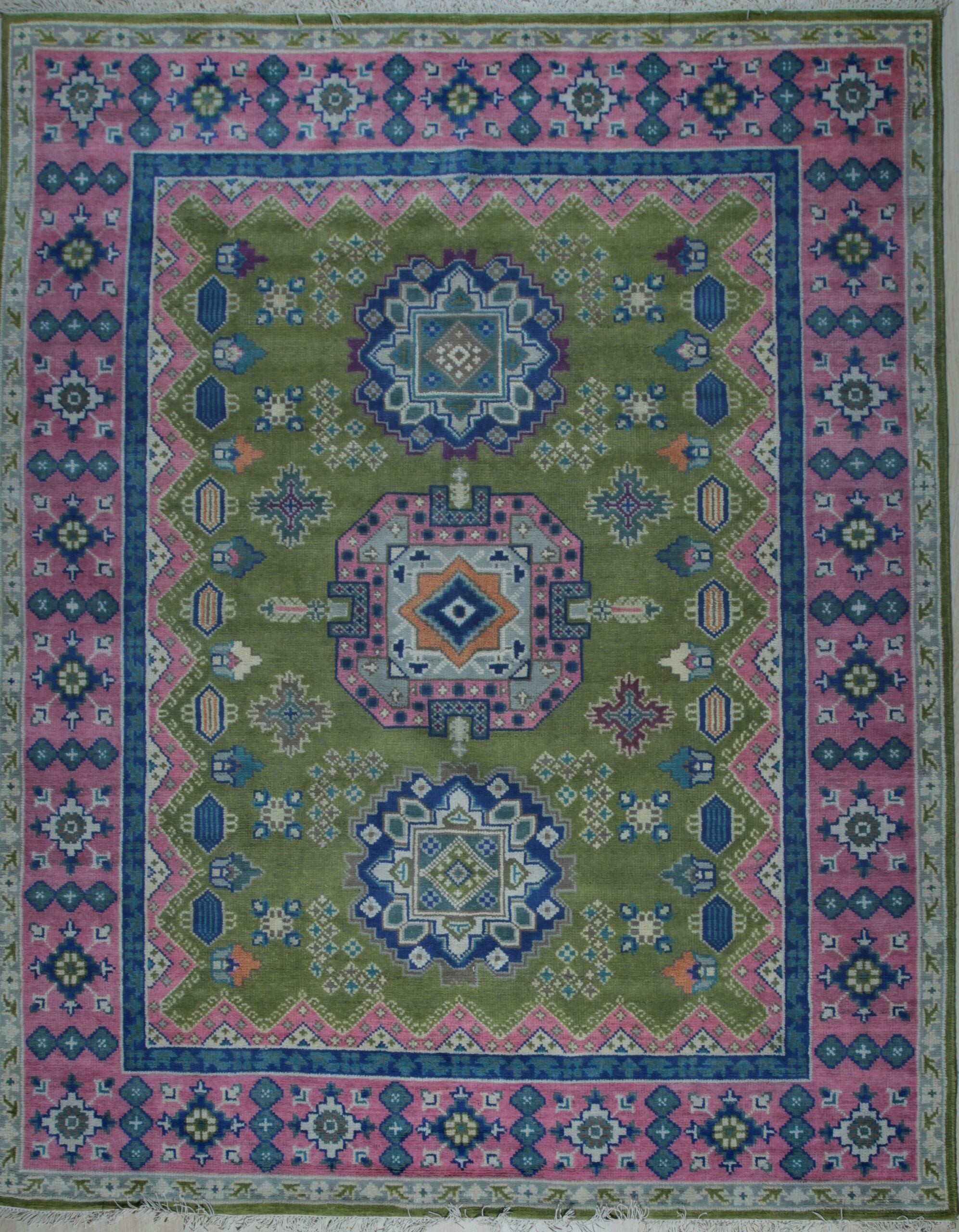 Green and fuchsia traditional Kazak hand-knotted wool rug, full overhead view