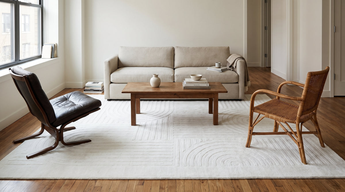 Handcrafted Artisan Ivory Hand Tufted Wool Rug in a living room