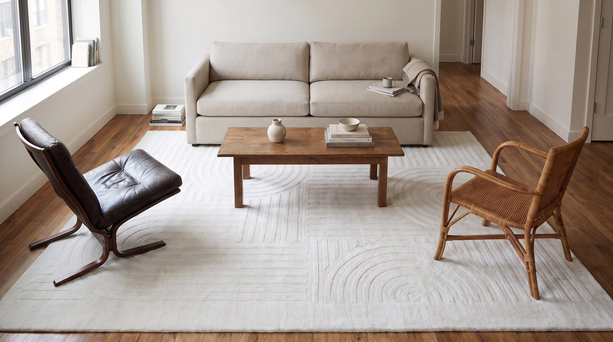 Handcrafted Artisan Ivory Hand Tufted Wool Rug in a living room