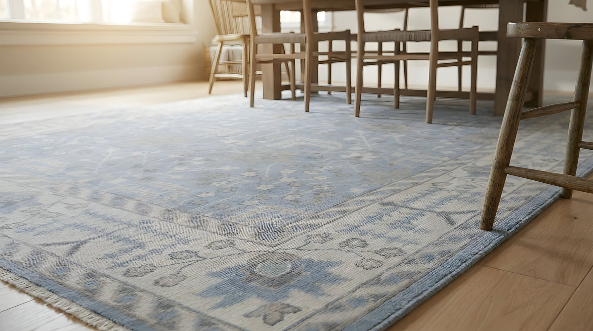 Harlow Traditional Blue and Gray Hand Knotted Wool Rug in a dining room