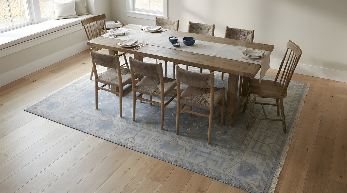 Harlow Traditional Blue and Gray Hand Knotted Wool Rug in a dining room