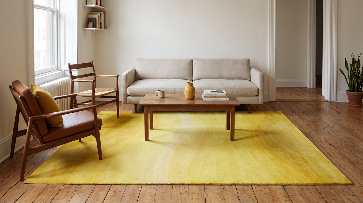 Inviting Ruby Yellow Hand Tufted Wool Rug in a living room