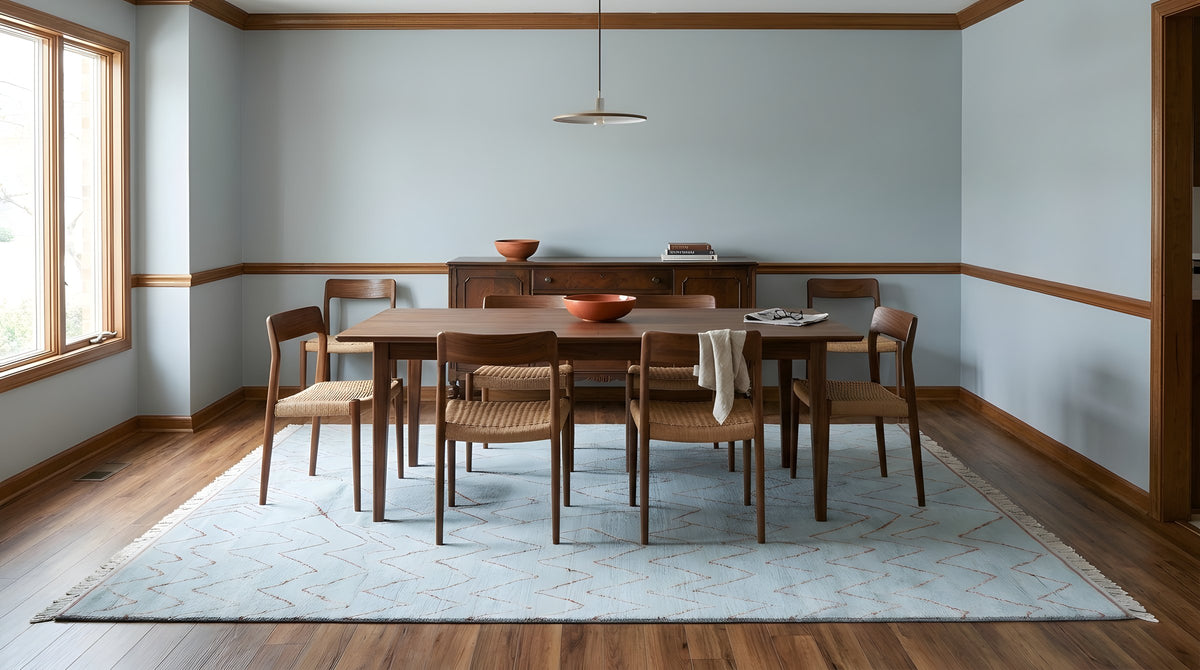 Isla Moroccan Light Blue Hand Knotted Wool Rug in a dining room