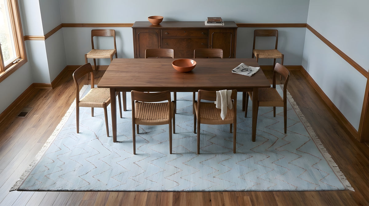 Isla Moroccan Light Blue Hand Knotted Wool Rug in a dining room