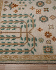 Ivory Oushak rug corner with willow-tree motif