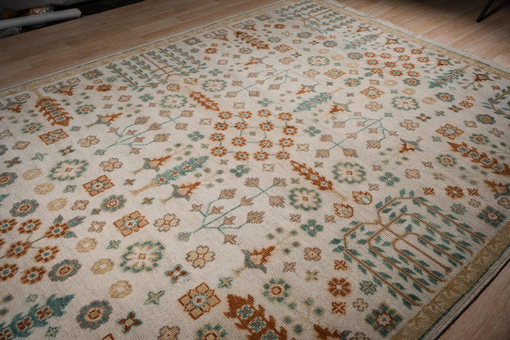 Ivory Oushak rug angled allover field detail
