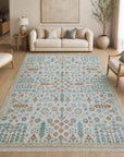 Ivory Oushak floral rug styled in a bright living room