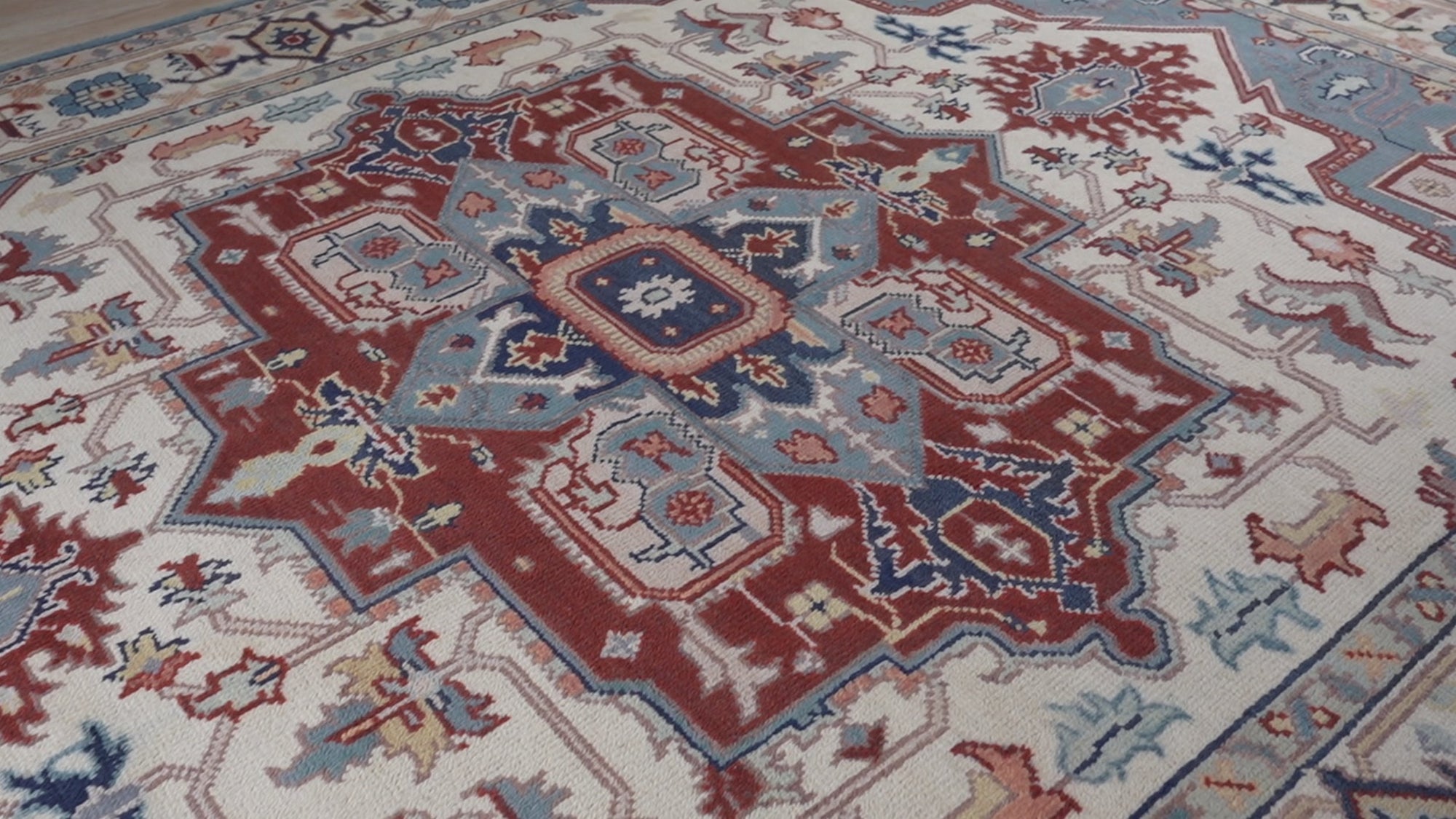 Ivory medallion rug medallion close-up in rust and slate blue