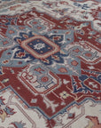 Ivory medallion rug medallion close-up in rust and slate blue