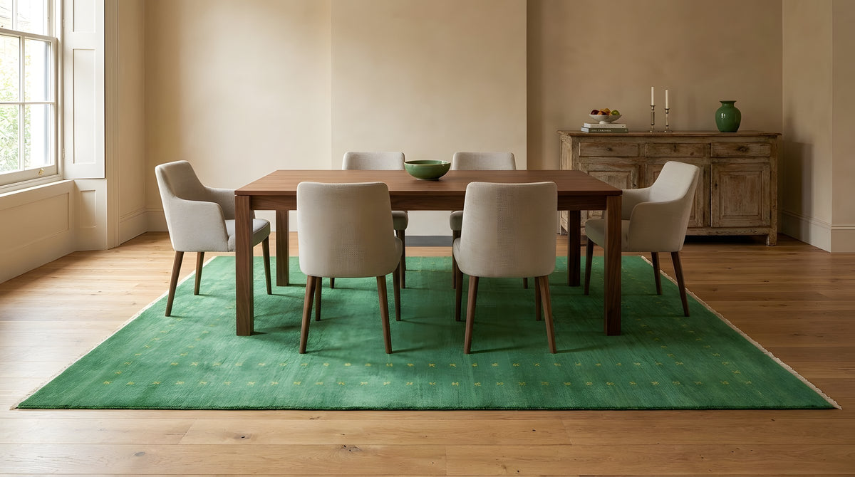 Jasmine Alluring Green Handmade Wool Rug in a dining room