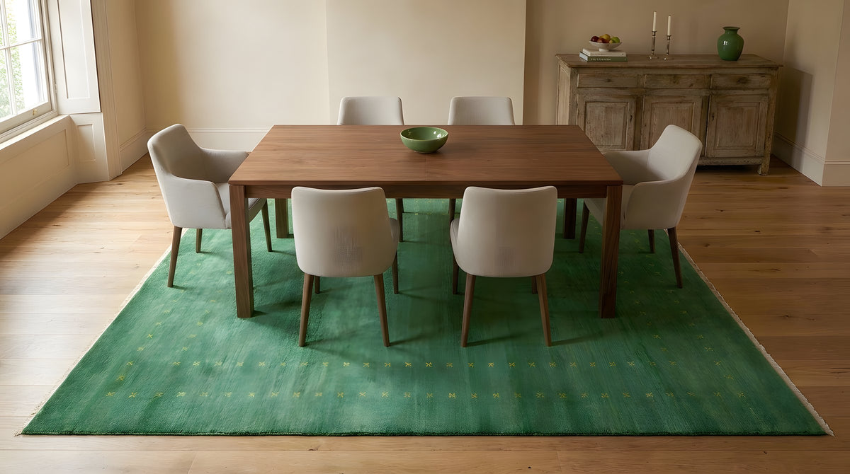 Jasmine Alluring Green Handmade Wool Rug in a dining room