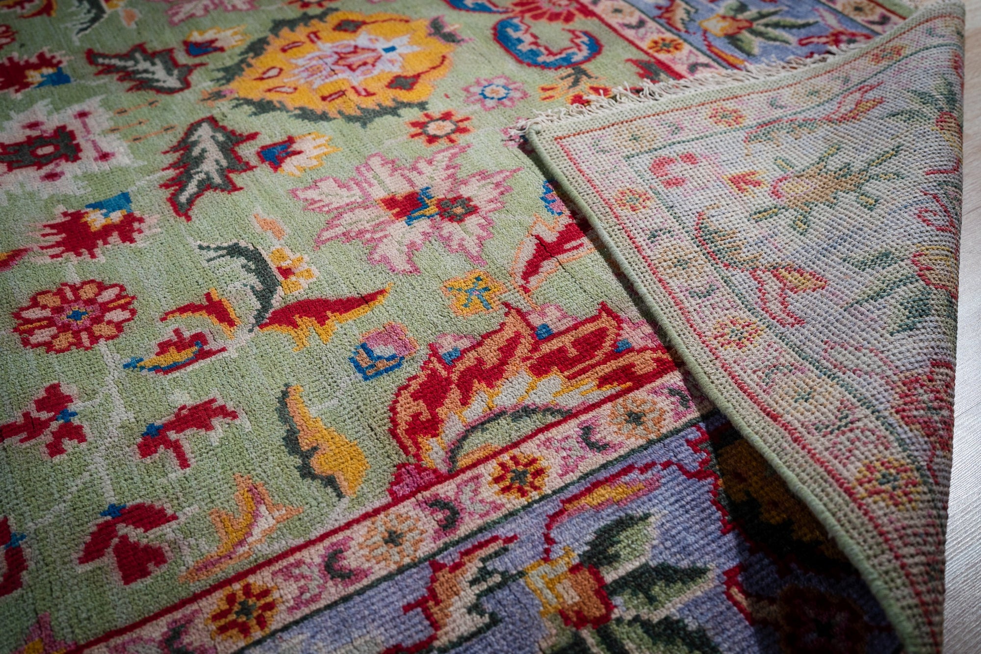 Light green Oushak rug back corner detail