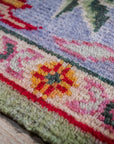 Light green Oushak rug border and corner detail