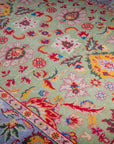 Light green Oushak rug floral field close-up