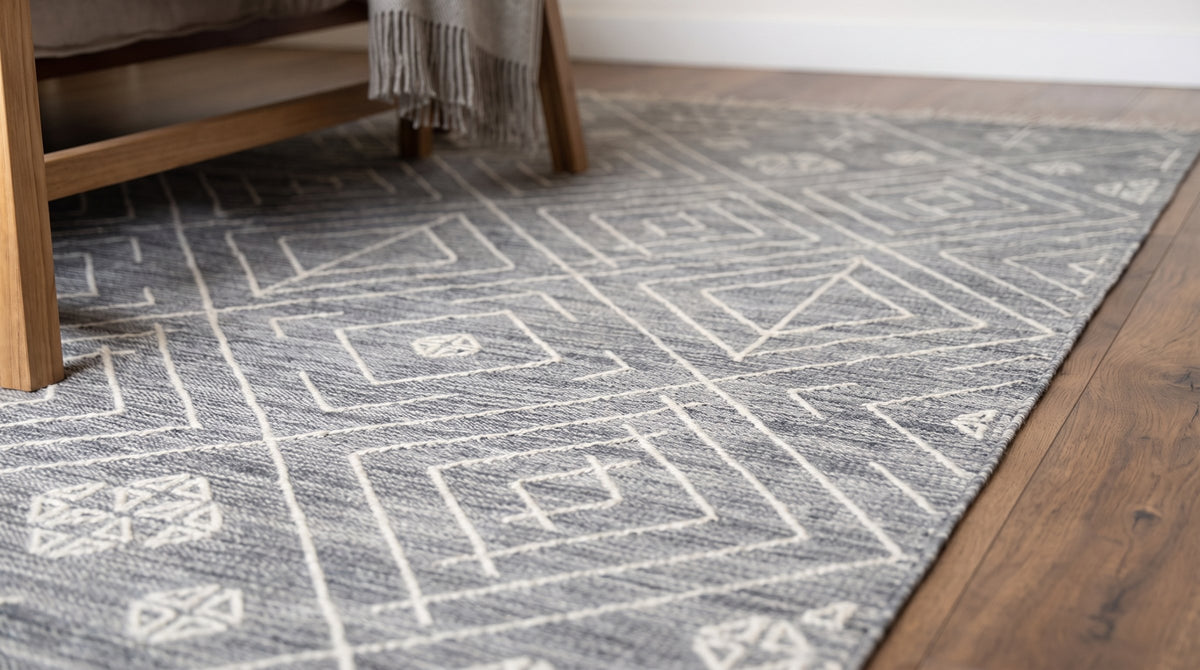 Luxurious Kilim Charcoal Handmade Wool Rug in a bedroom