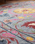 Maya Artisan Blue Hand Tufted Wool Rug in a dining room